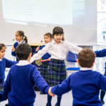 children holding hands in a circle