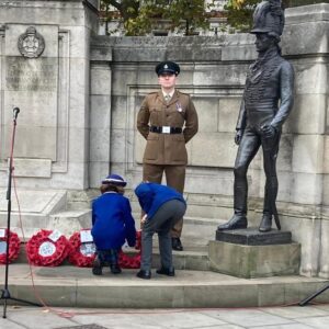 children laying down wreaths