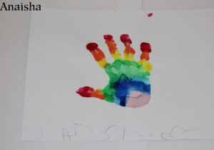 A hand painted using rainbow paint