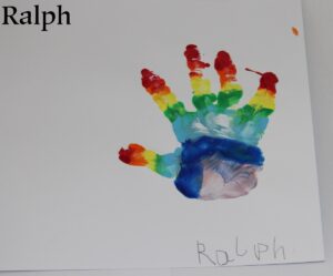 A rainbow painted hand print