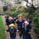 children standing under a tree