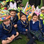 children wearing colourful easter bonnets