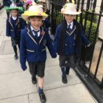 children marching in their easter bonnets