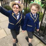 children wearing their easter bonnets outside