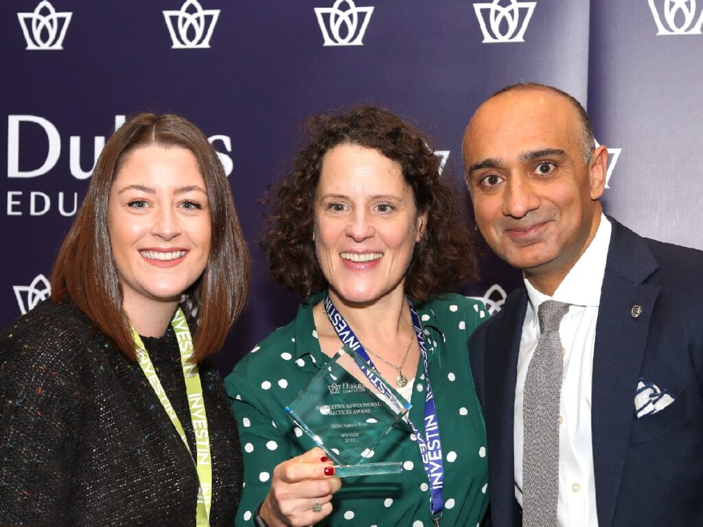 Lady holding an award