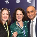 Lady holding an award