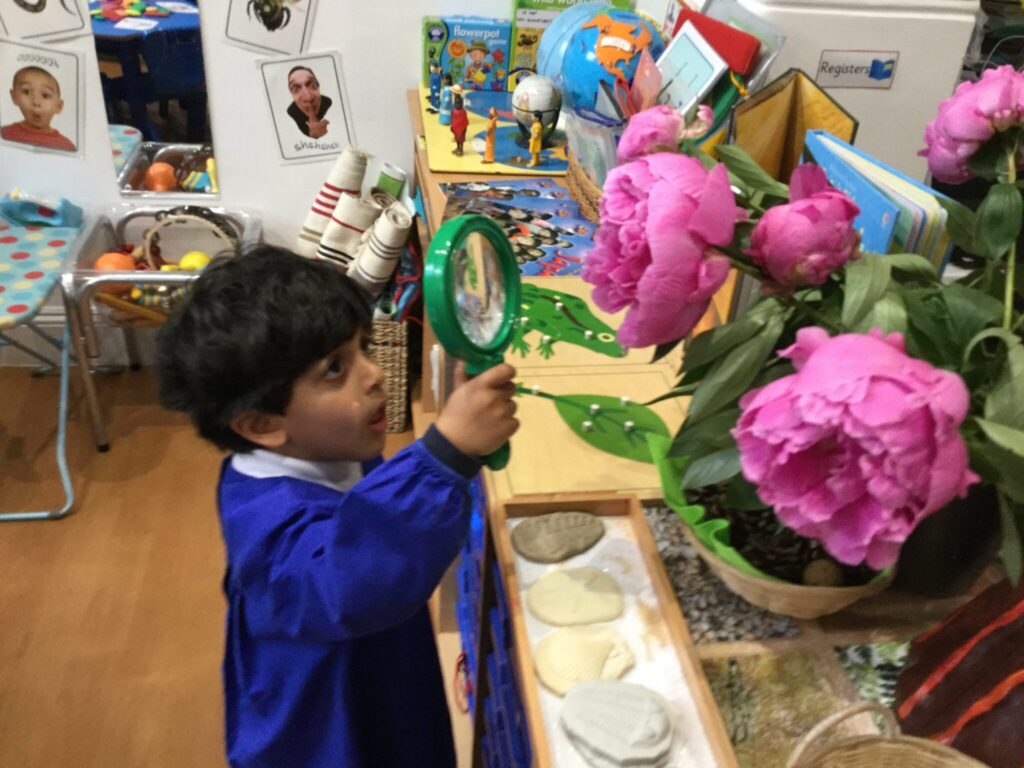 a child with a magnifying glass